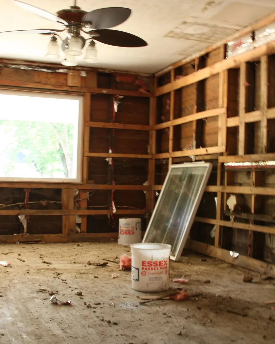 A water-damaged room stripped back to the studs